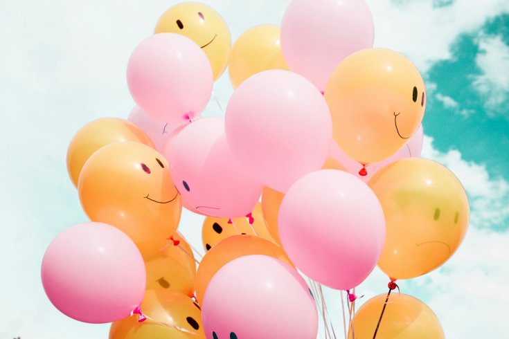 Bright balloons floating in the sky, symbolizing the lightness and freedom that comes from cognitive defusion in ACT therapy.