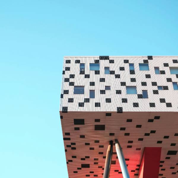 Exterior of a modern professional building symbolizing a supportive space for therapy and personal growth, where clients work on goal setting and achieving meaningful change.